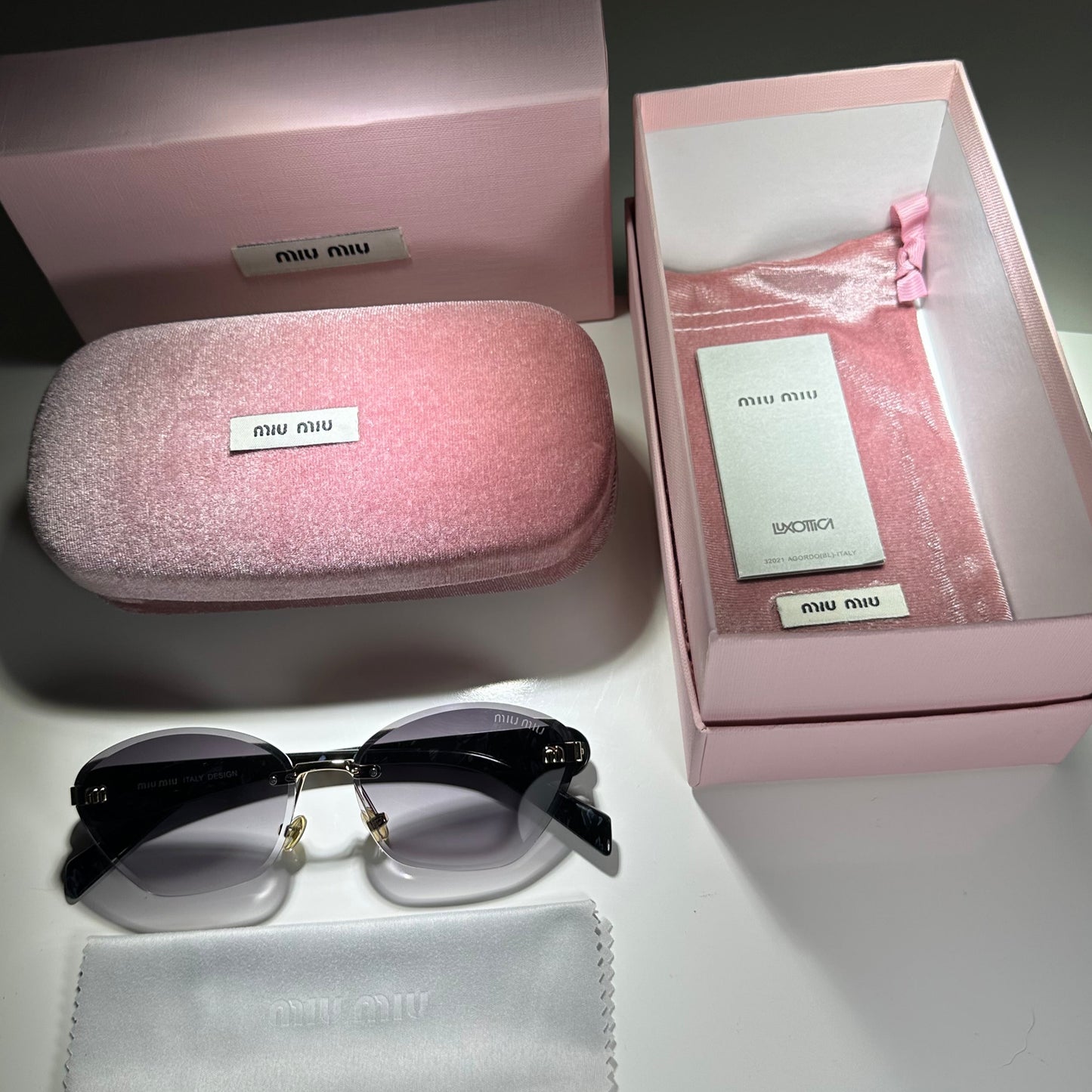 MIU MIU MU77