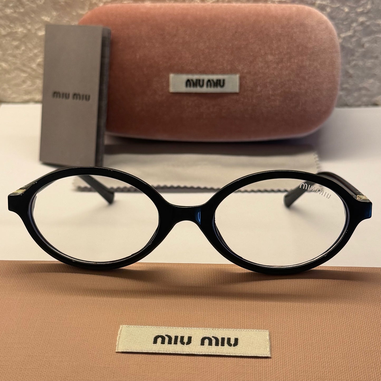 MIU MIU 04ZS ARMAZON