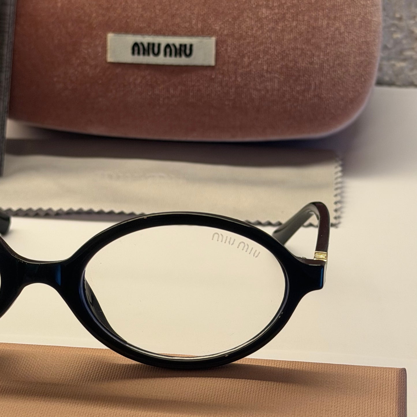 MIU MIU 04ZS ARMAZON